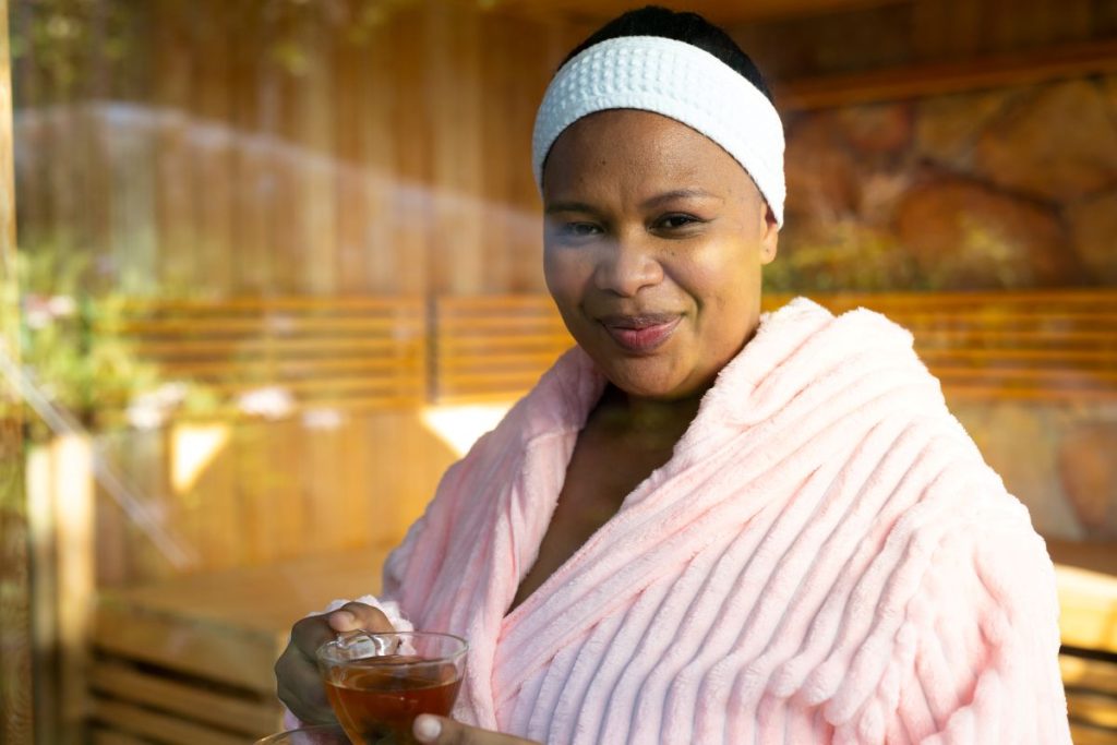 portrait-of-happy-plus-size-african-american-woman-in sauna
