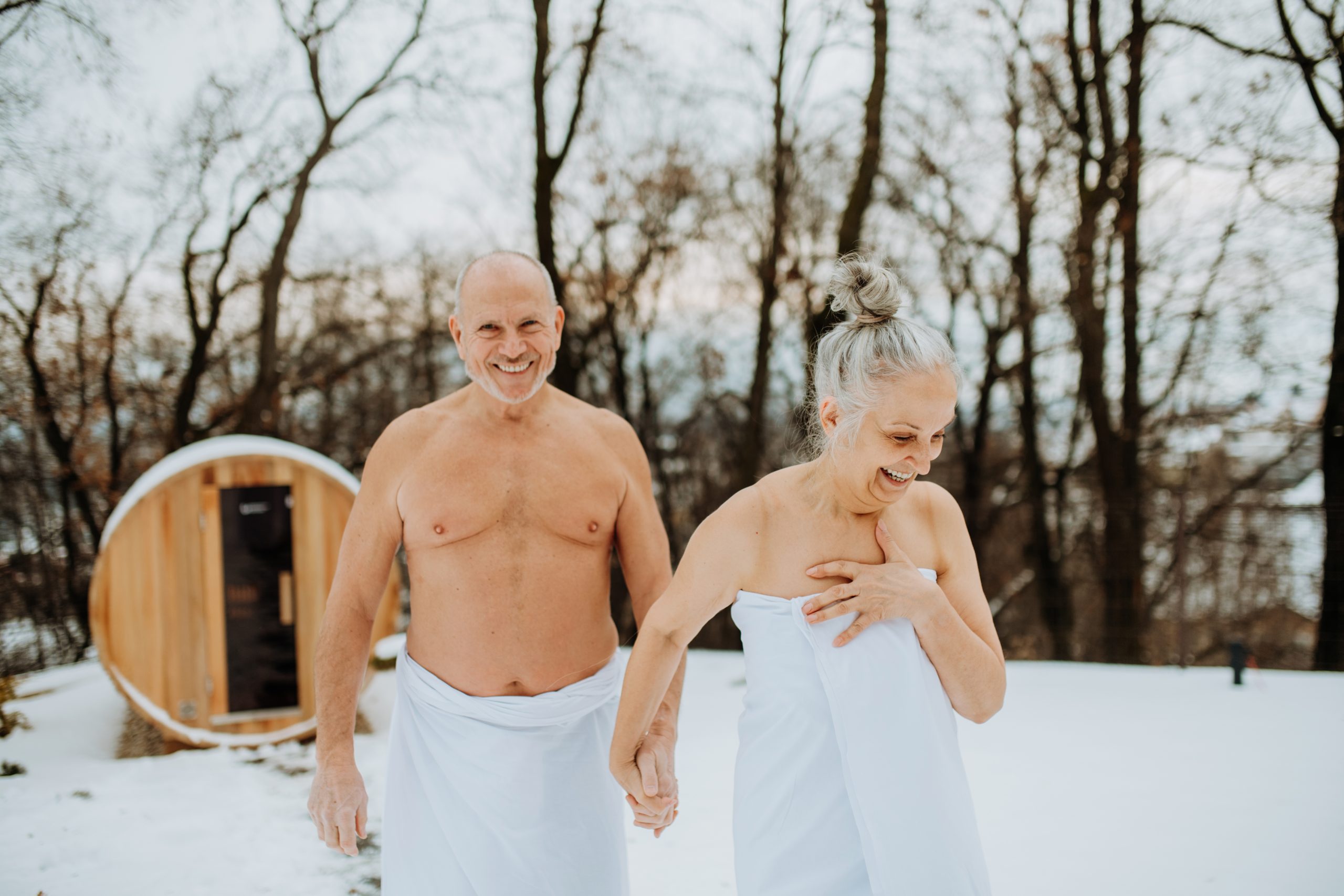 senior-woman-in-towel-with-her-husband-coming-out